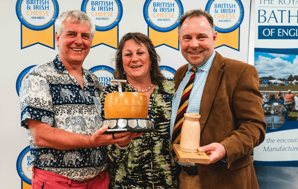 Sarai wins the lifetime achievement award at the British Cheese Awards. Here she’s holding the award alongside colleagues.
