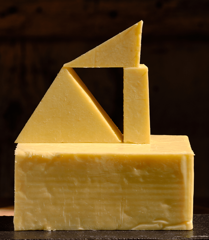 Longmans Cheese in four blocks, one larger rectangle with three smaller rectangles.